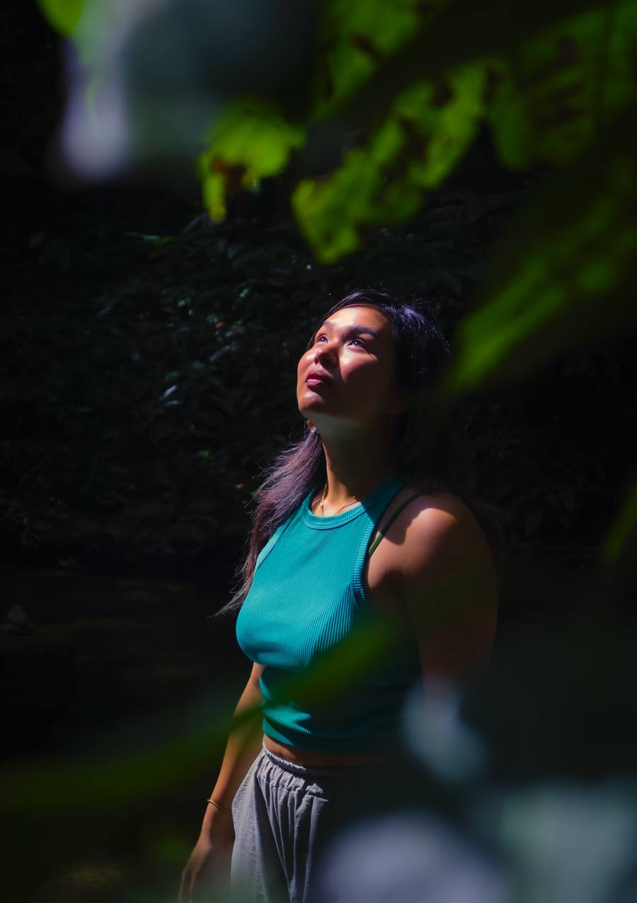 Sophie looking up through forest canopy