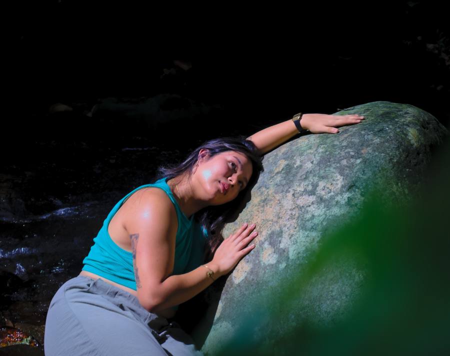 Sophie with mossy boulder